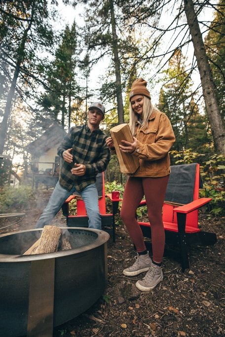 couple starting a fire at the glampground