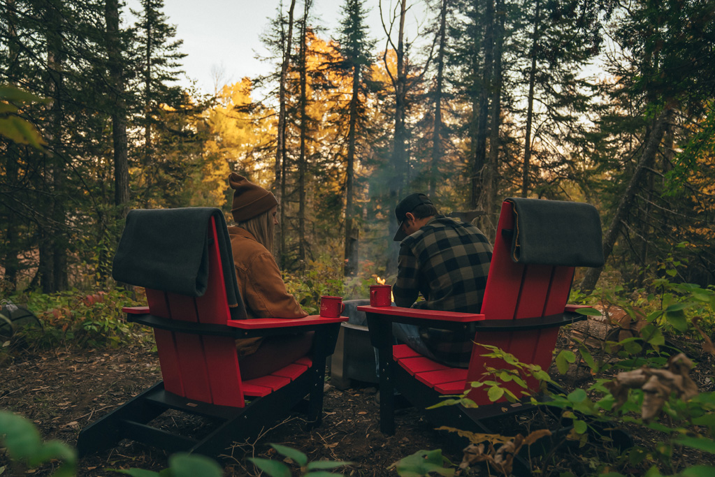 Two people camping in the forest.