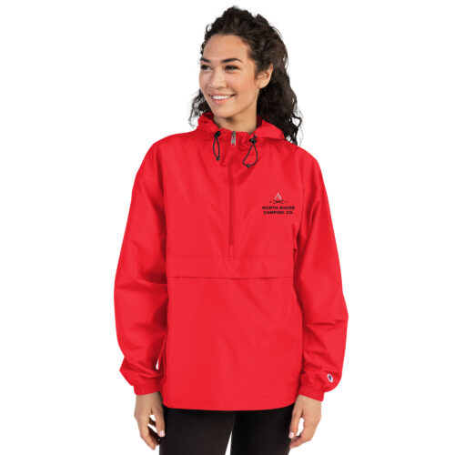 Person wearing red windbreaker jacket.
