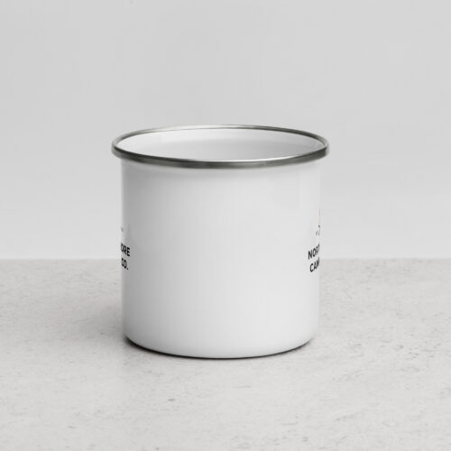 White enamel camping mug on light surface