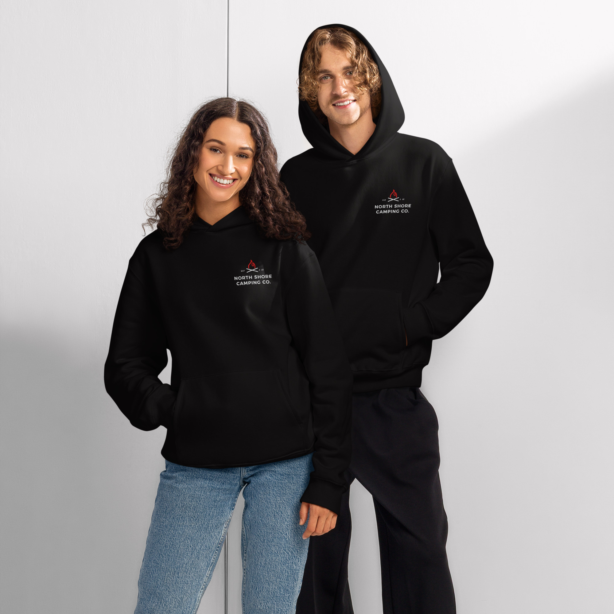 Two models wearing black camping hoodies
