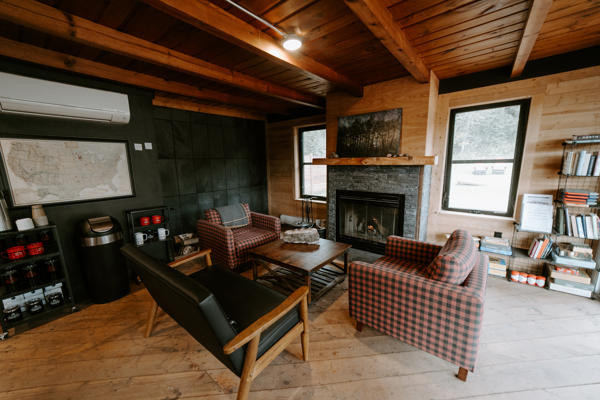 nscc 0923 139 Cozy room with fireplace and wooden interior.