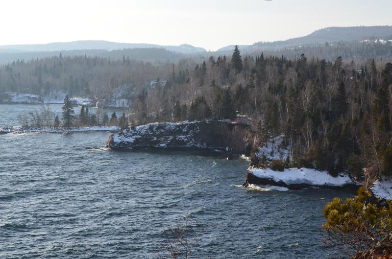 dsc 0027 Snowy forested shoreline at Lake Superior in winter.