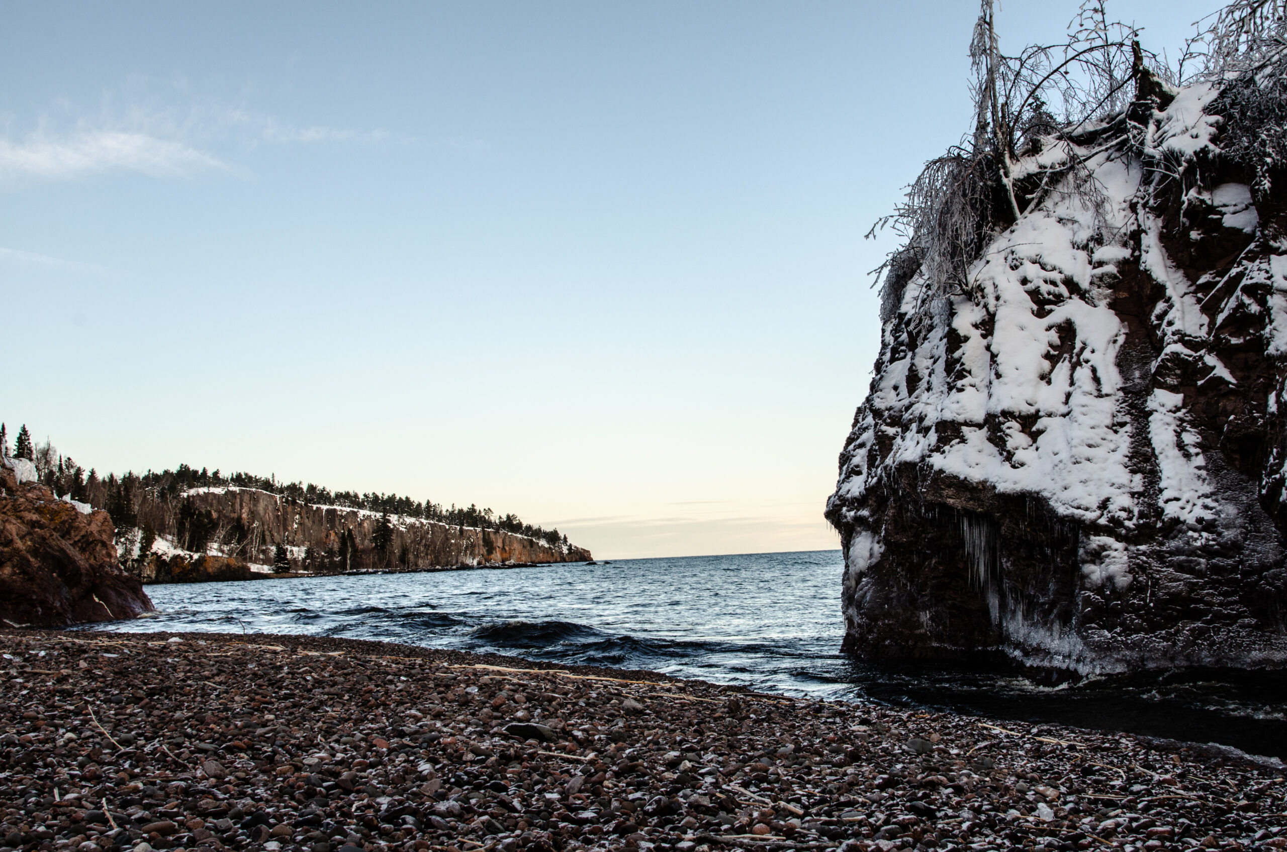 dsc 0072 Snow-covered cliff by the sea during winter.