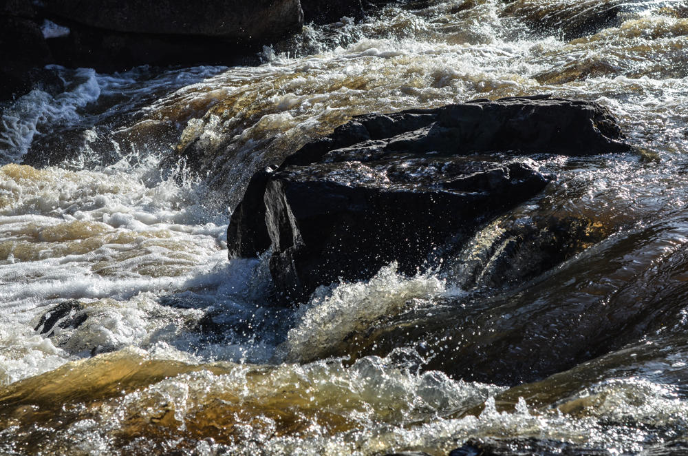Flowing river over mossy rocks