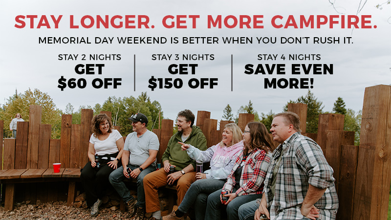 Memorial Day sale banner with group around campfire.